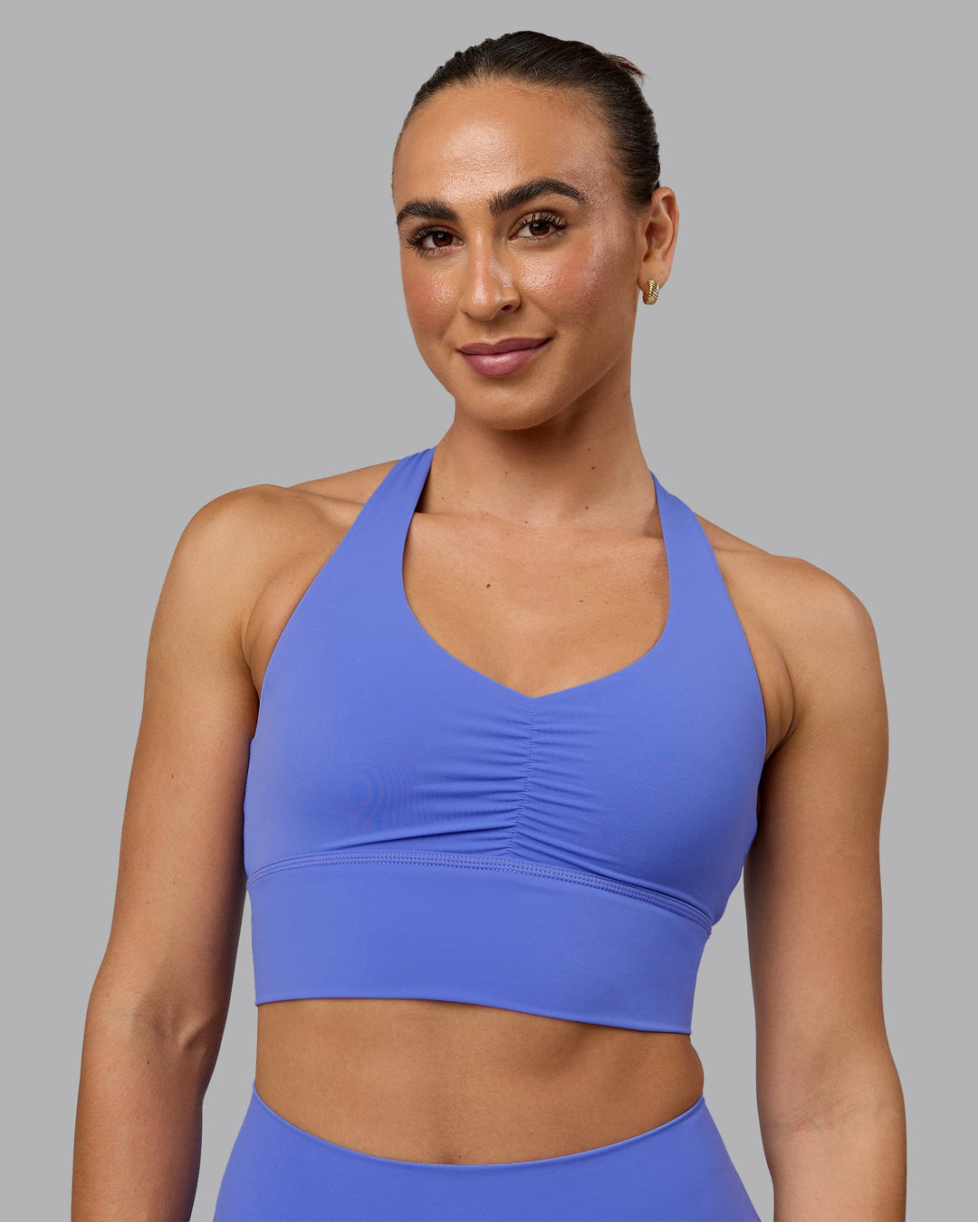 Woman wearing Evoke Sports Bra - Baja Blue