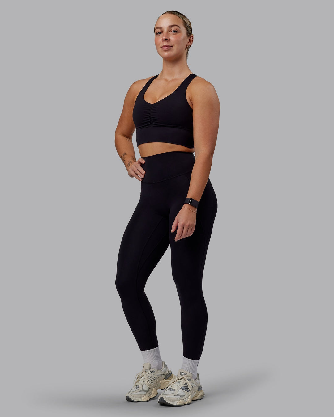 Woman wearing Evoke Sports Bra - Black