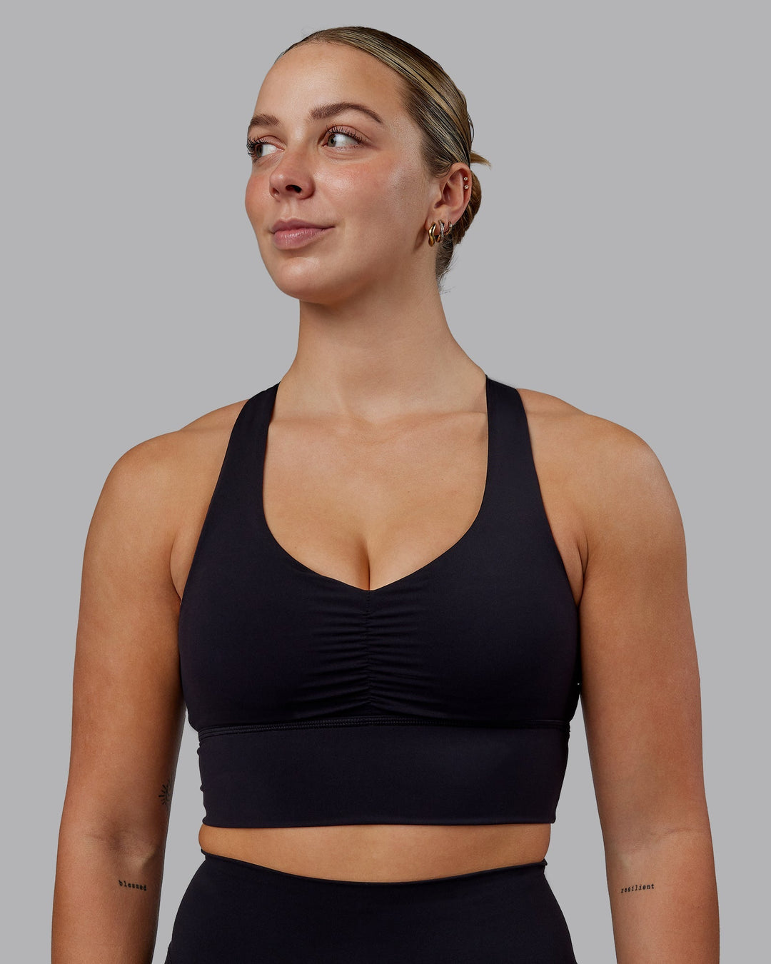 Woman wearing Evoke Sports Bra - Black