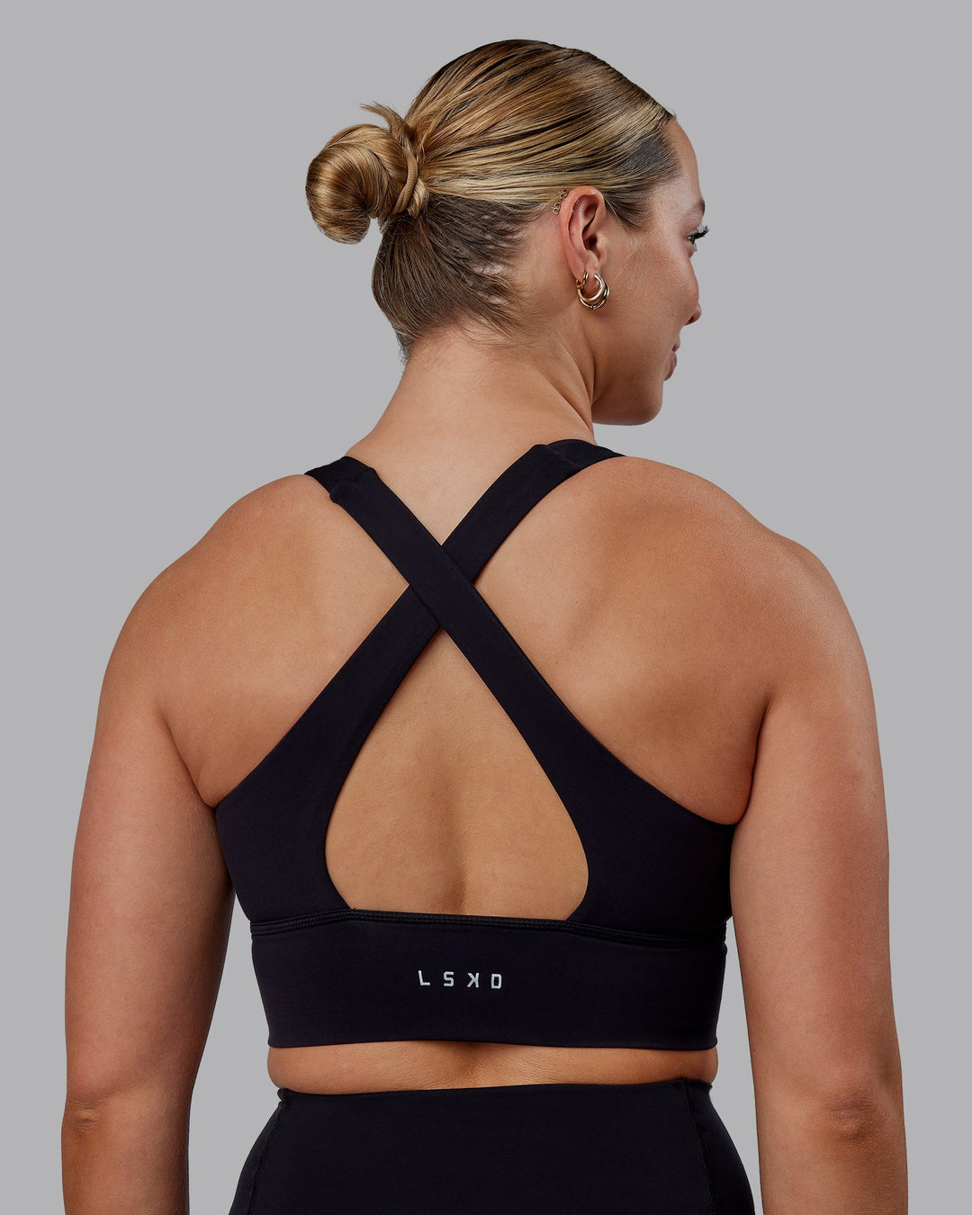 Woman wearing Evoke Sports Bra - Black