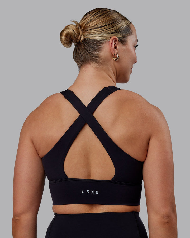 Woman wearing Evoke Sports Bra - Black
