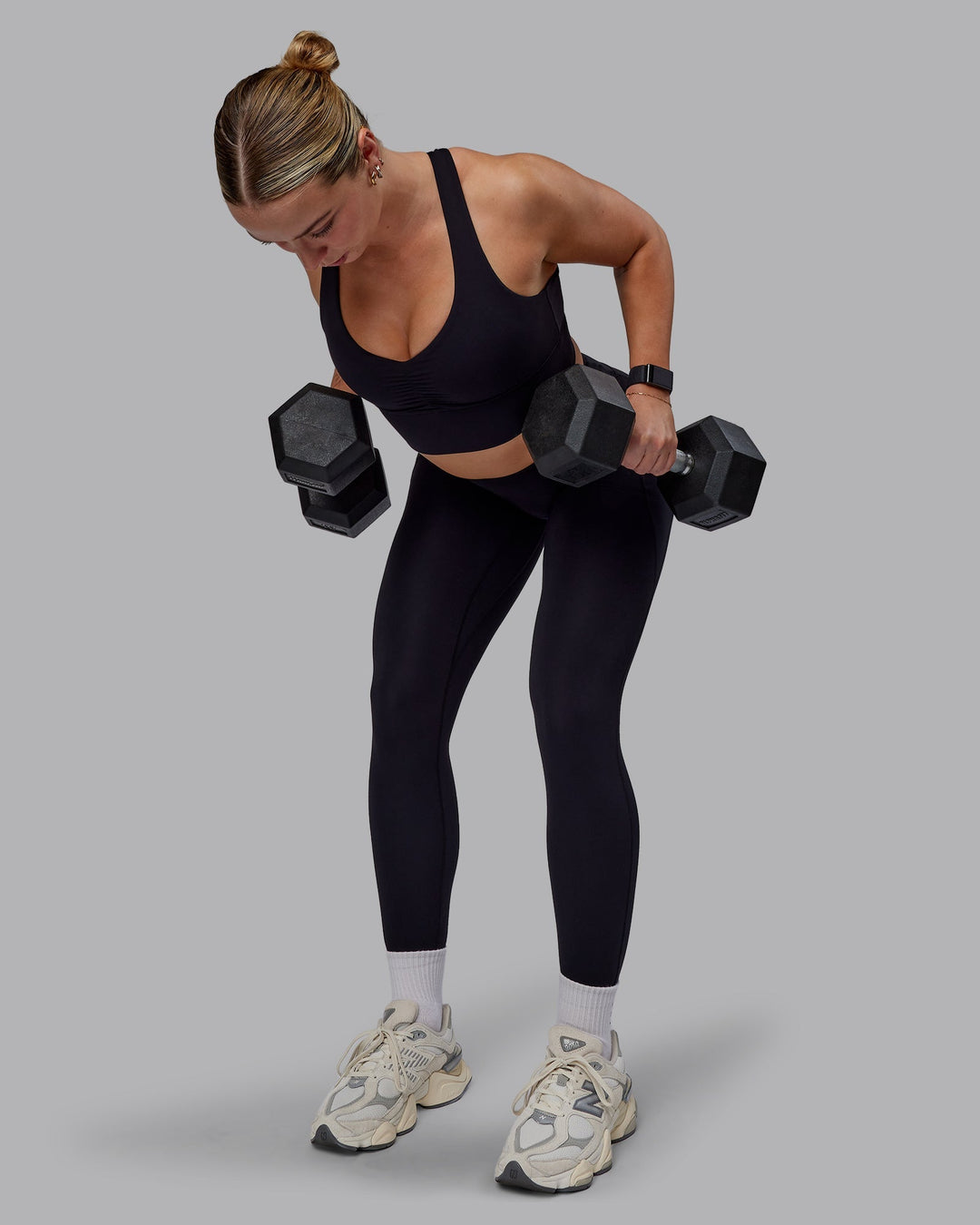 Woman wearing Evoke Sports Bra - Black