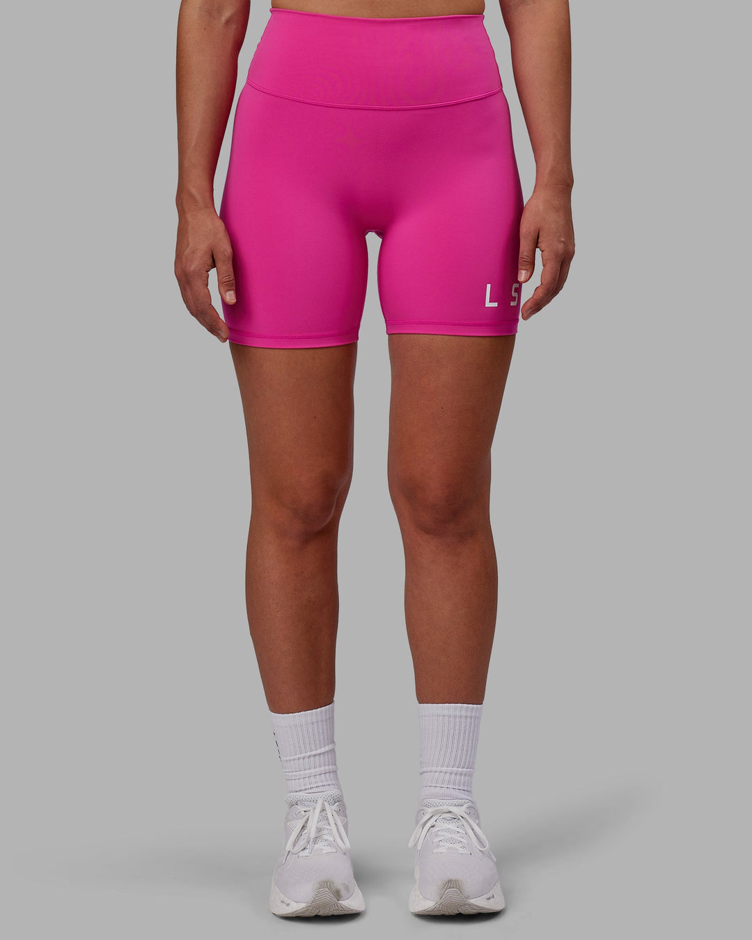 Woman wearing Evolved Mid Short Tights - Fuchsia Pink-White