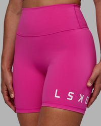 Woman wearing Evolved Ultra High-Rise 6" Short - Fuchsia Pink-White