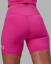 Woman wearing Evolved Ultra High-Rise 6" Short - Fuchsia Pink-White