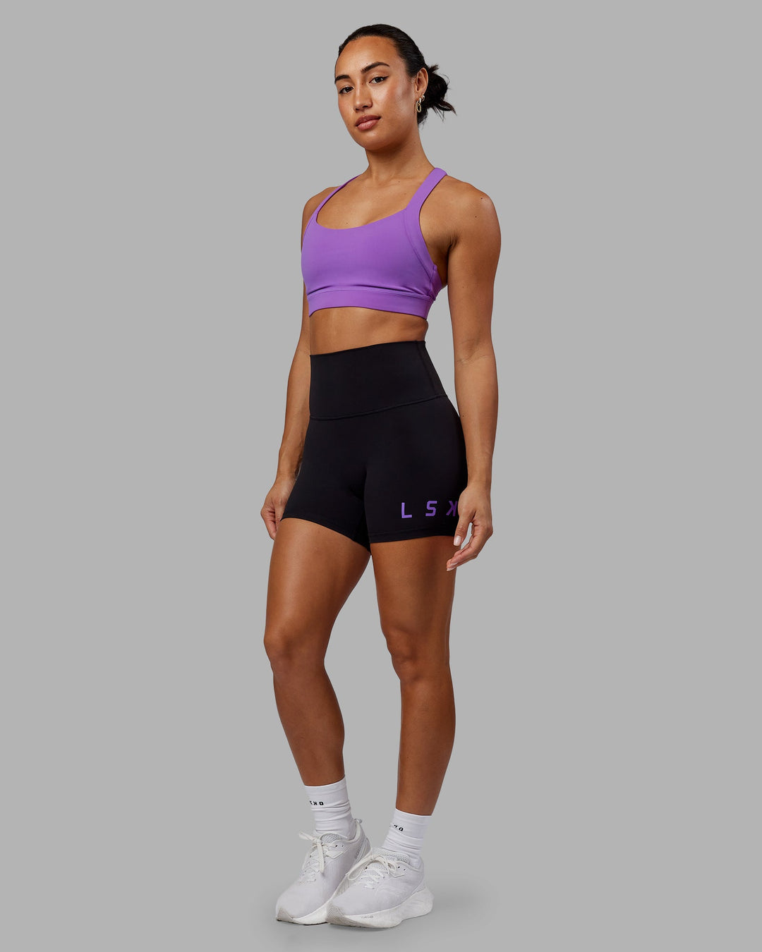 Woman wearing Evolved X-Length Shorts - Black-Purple Swirl