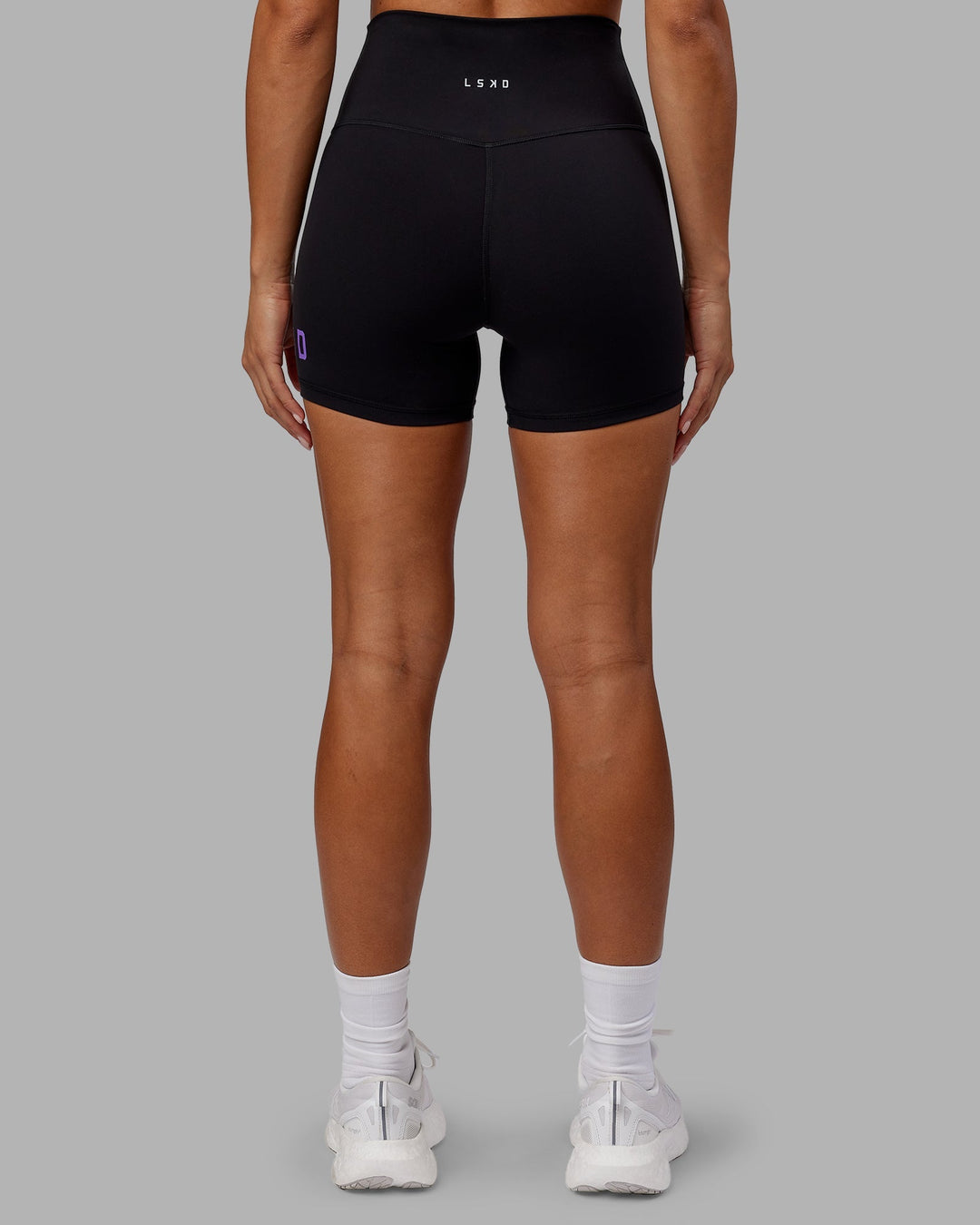 Woman wearing Evolved X-Length Shorts - Black-Purple Swirl