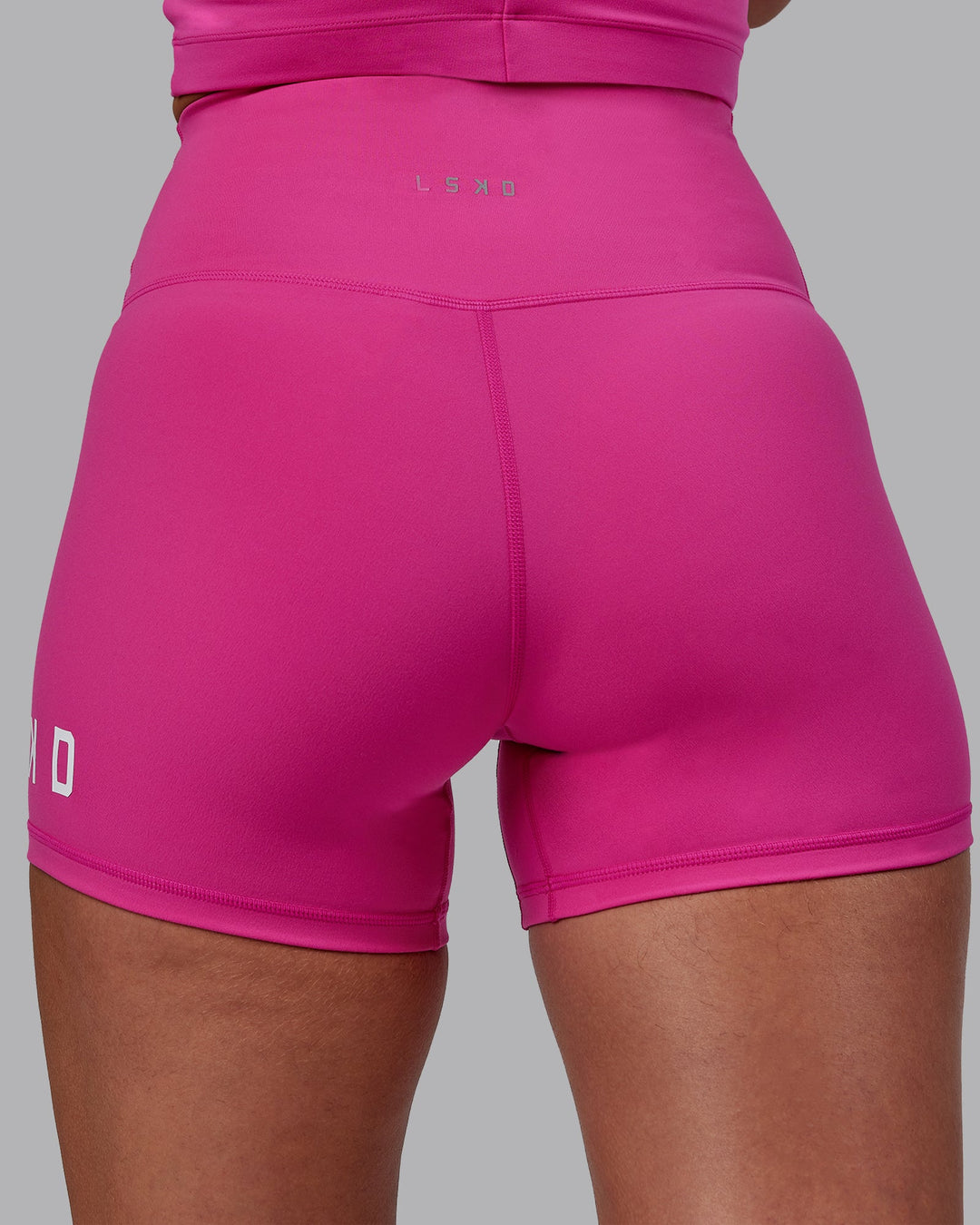 Woman wearing Evolved X-Short Tights - Fuchsia Pink-White