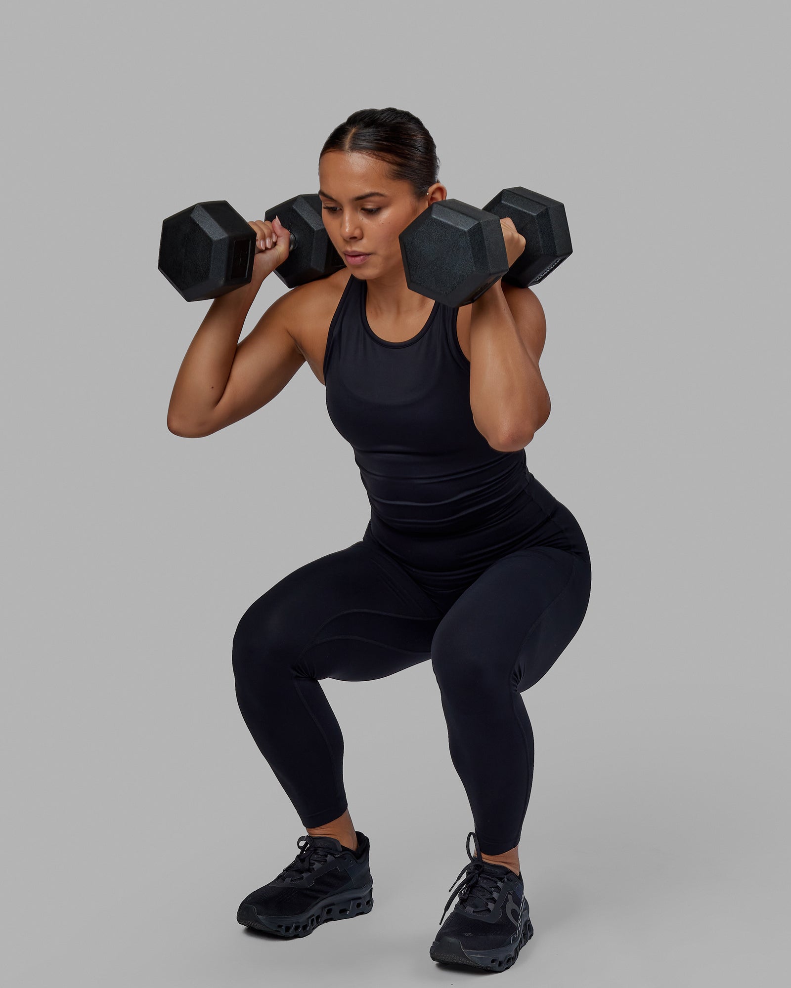 Woman wearing Flow Performance Tank - Black | Model:Xantheia | Size:S