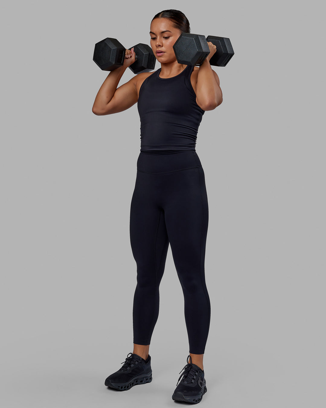 Woman wearing Flow Performance Tank - Black | Model:Xantheia | Size:S