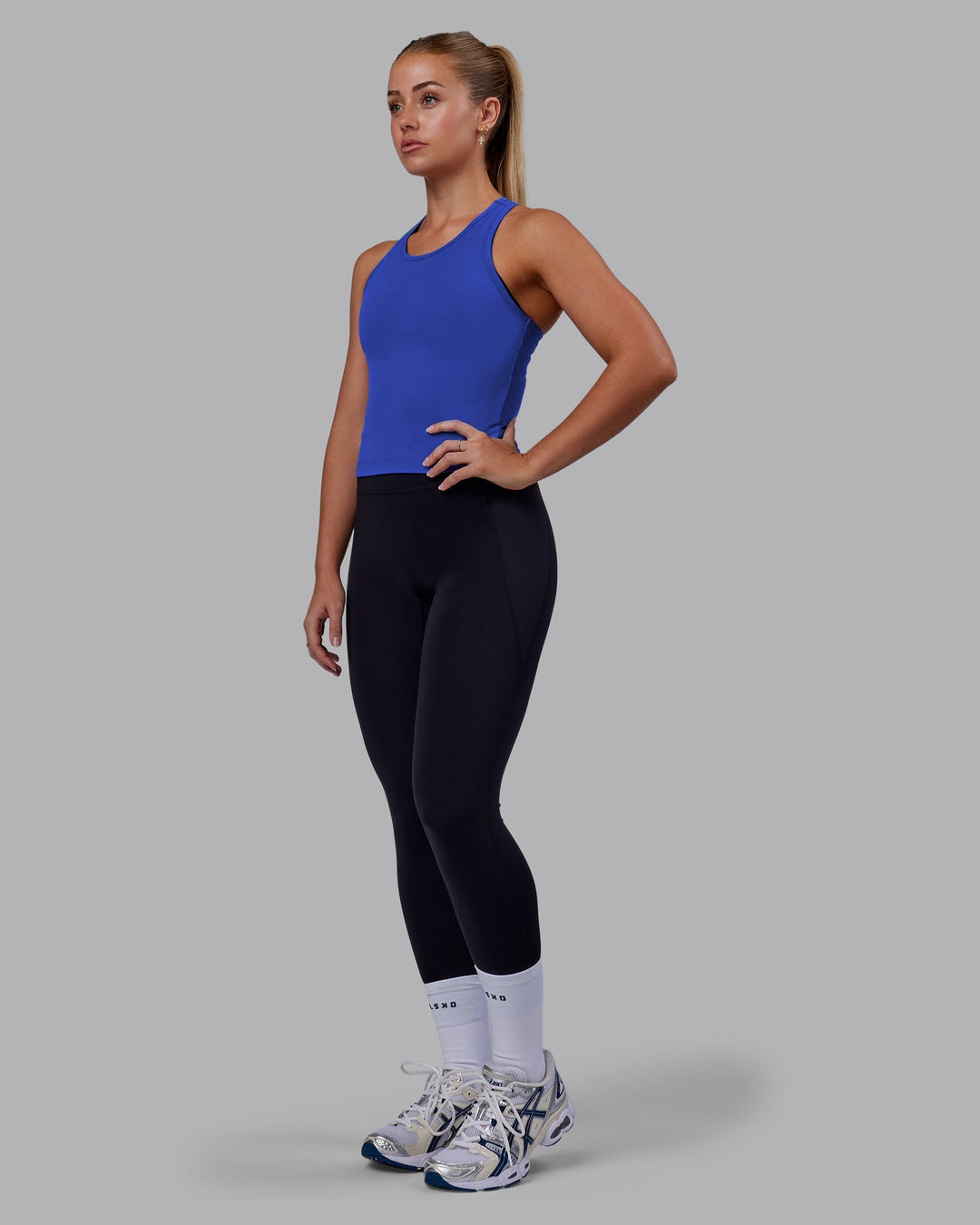 Woman wearing Flow Performance Tank - Power Cobalt