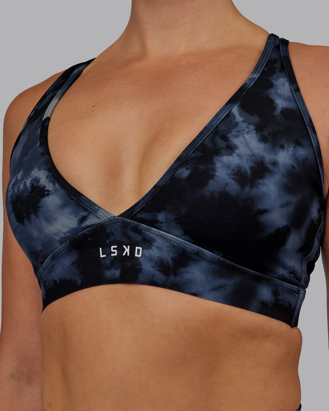 Woman wearing Form Sports Bra - Tie Dye-Midnight