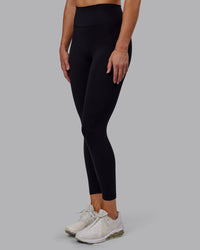 Woman wearing Fusion Ultra High-Rise 7/8 Legging - Black | Model:Hannah | Size:S