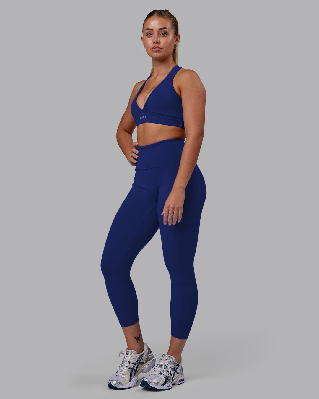 Woman wearing Fusion 7/8 Length Leggings - Midnight Blue