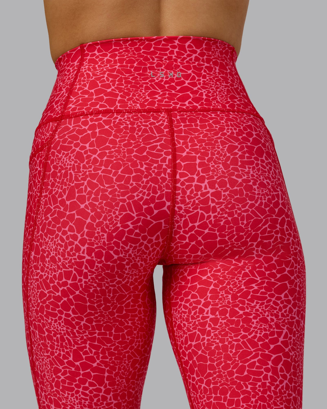 Woman wearing Fusion 7/8 Length Tights - Red Vitality Print