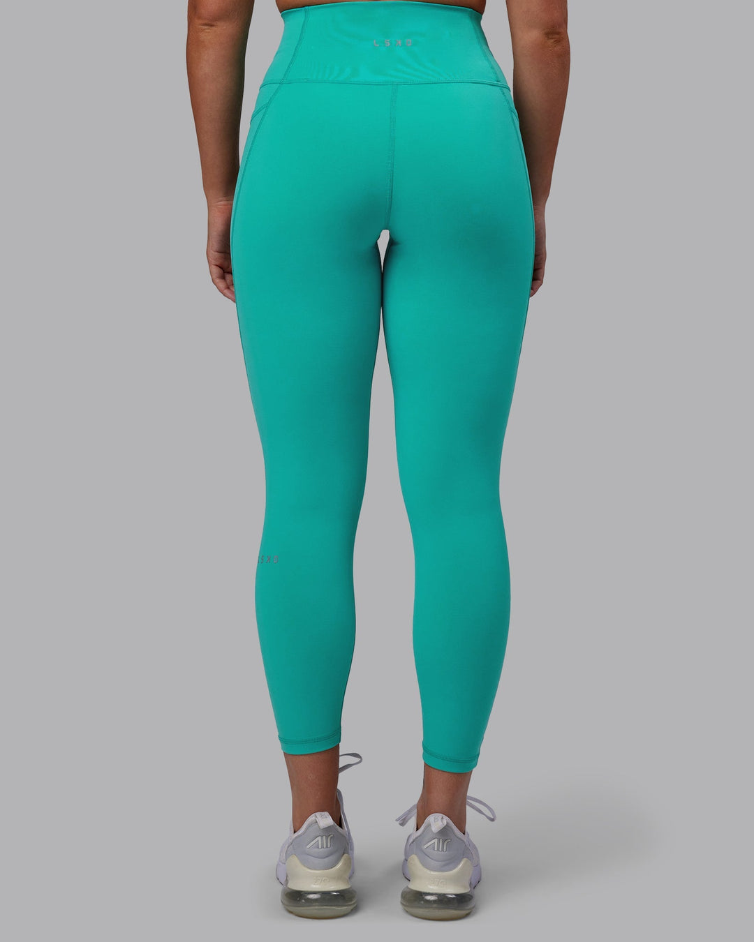 Woman wearing Fusion 7/8 Length Leggings - Turquoise Tide