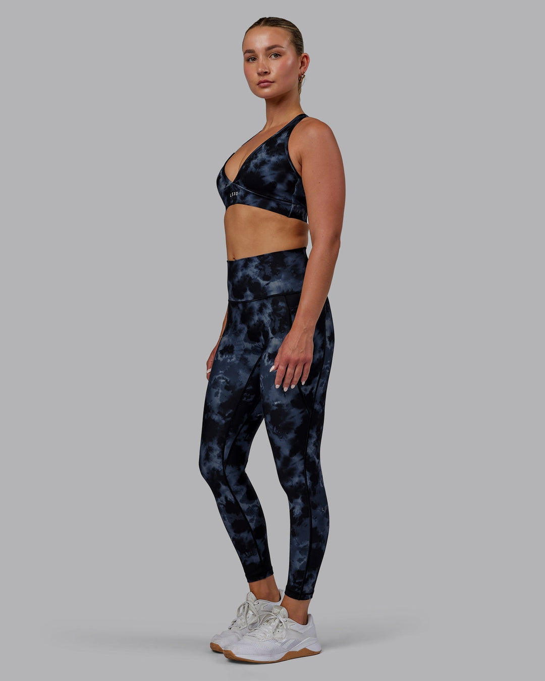 Woman wearing Fusion 7/8 Length Leggings - Tie Dye-Midnight