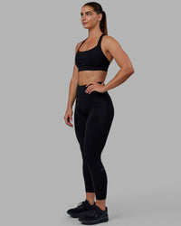 Woman wearing O.G. Fusion Ultra High-Rise 7/8 Legging Pockets - Black | Model:Annabelle | Size:S