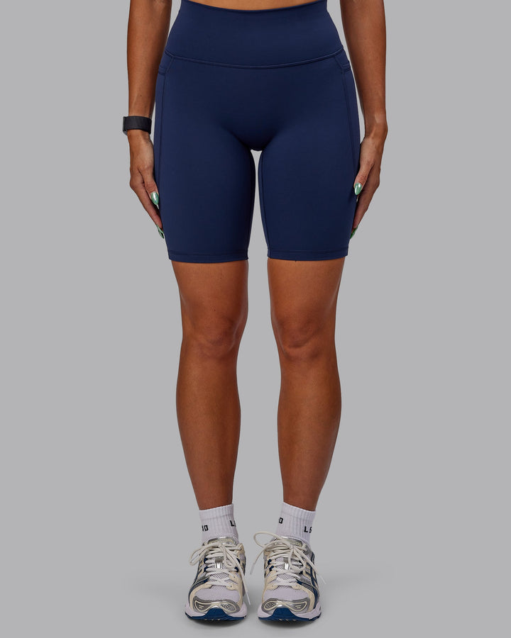 Woman wearing Fusion Bike Shorts with Pockets - Future Navy
