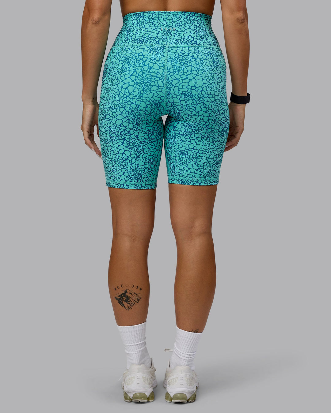 Woman wearing Fusion Bike Shorts - Aquatic Awe Vitality Print