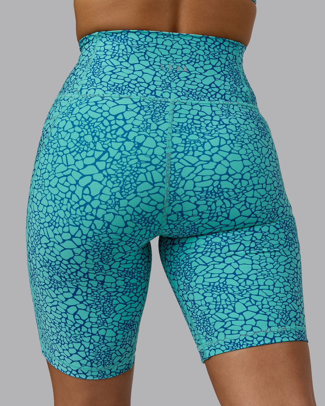 Woman wearing Fusion Bike Shorts - Aquatic Awe Vitality Print