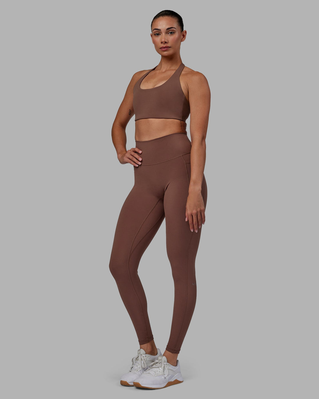 Woman wearing Fusion Full Length Leggings - Dull Rust