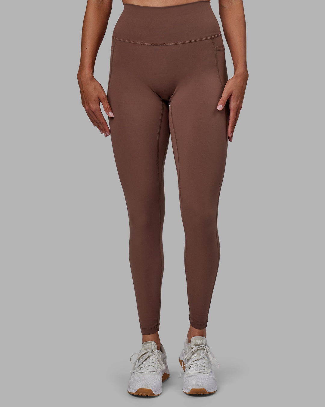 Woman wearing Fusion Full Length Leggings - Dull Rust