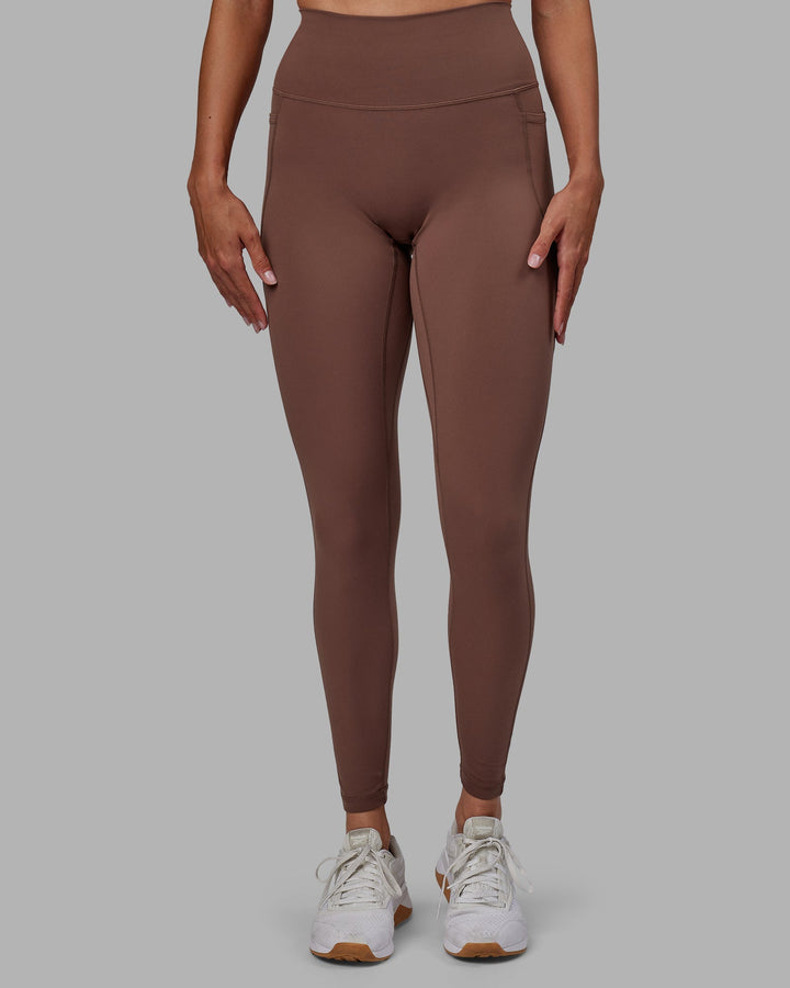 Woman wearing Fusion Full Length Leggings - Dull Rust
