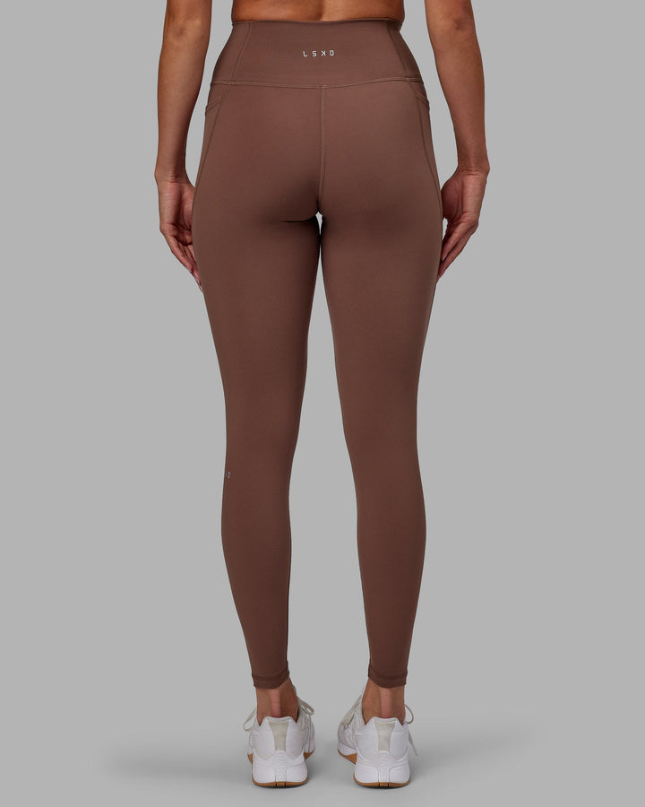 Woman wearing Fusion Full Length Leggings - Dull Rust
