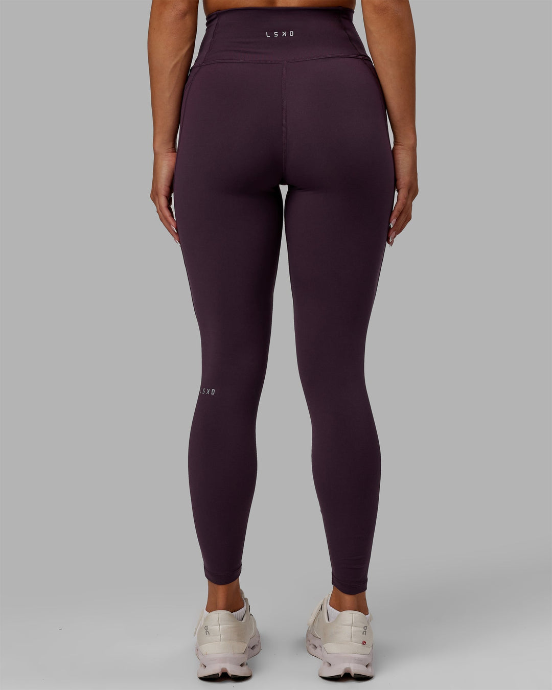 Woman wearing Fusion Ultra High-Rise Full Length Legging Pockets - Midnight Plum | Model:Gabby | Size:S
