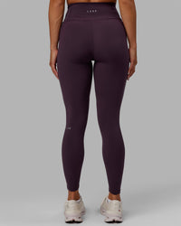 Woman wearing Fusion Ultra High-Rise Full Length Legging Pockets - Midnight Plum | Model:Gabby | Size:S