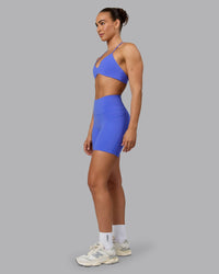 Woman wearing Fusion Ultra High-Rise 6" Short Pockets - Baja Blue | Model:Sophie | Size:S