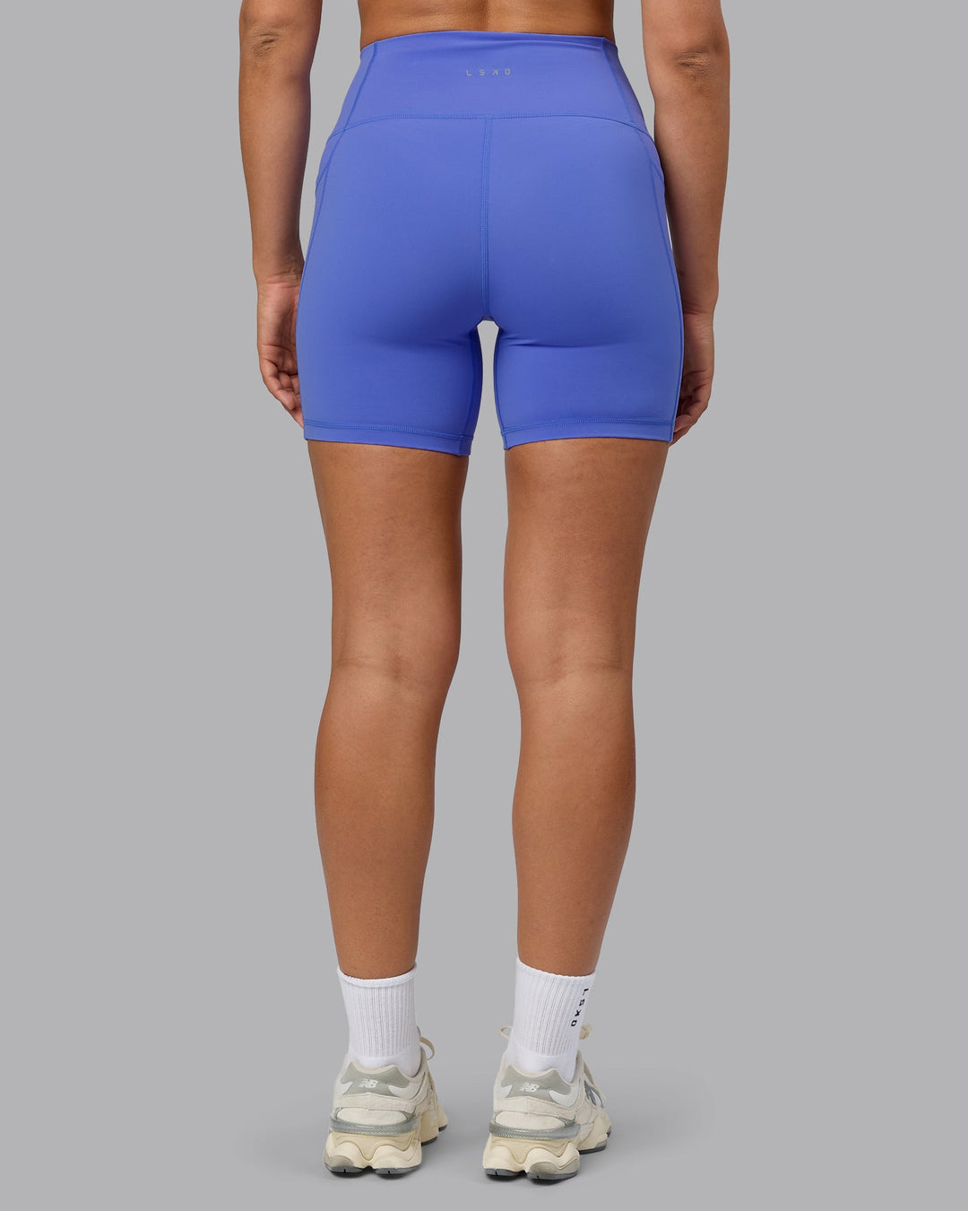 Woman wearing Fusion Mid Short Tights with Pockets - Baja Blue