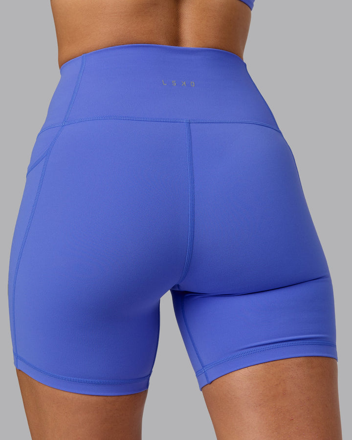 Woman wearing Fusion Mid Short Tights with Pockets - Baja Blue
