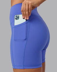 Woman wearing Fusion Ultra High-Rise 6" Short Pockets - Baja Blue | Set:true | Angle:closeup | Model:Sophie | Size:S