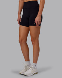 Woman wearing Fusion Ultra High-Rise 6" Short - Black | Model:Hannah | Size:S
