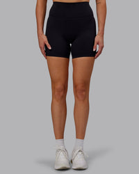 Woman wearing Fusion Ultra High-Rise 6" Short - Black | Model:Hannah | Size:S