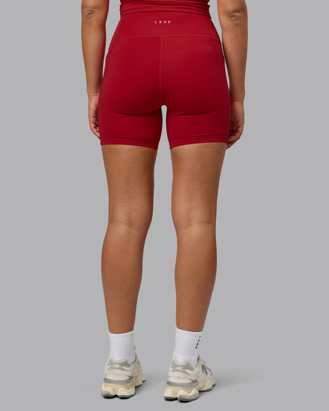 Woman wearing Fusion Mid Short Tights with Pockets - Cherry Red