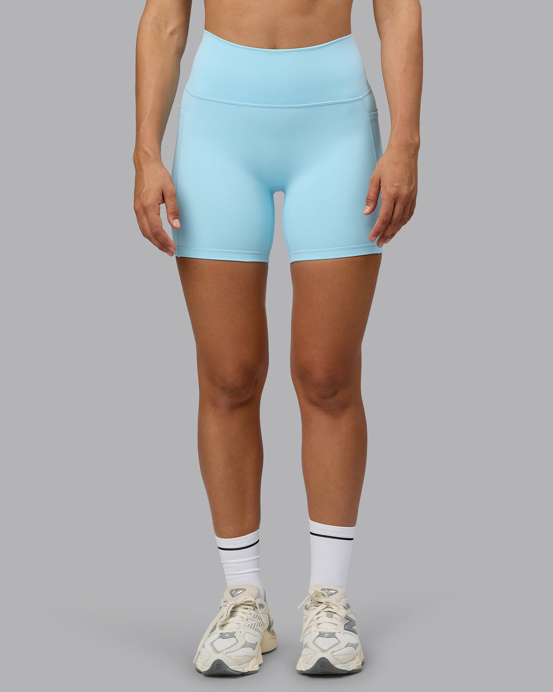 Woman wearing Fusion Mid Short Tights with Pockets - Crystal Blue