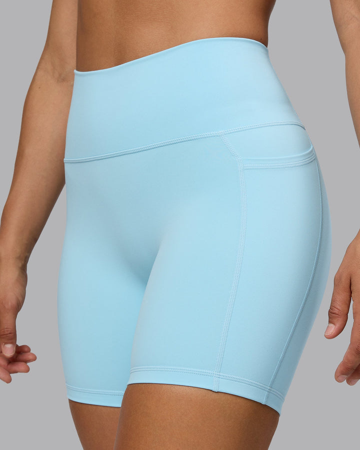 Woman wearing Fusion Mid Short Tights with Pockets - Crystal Blue
