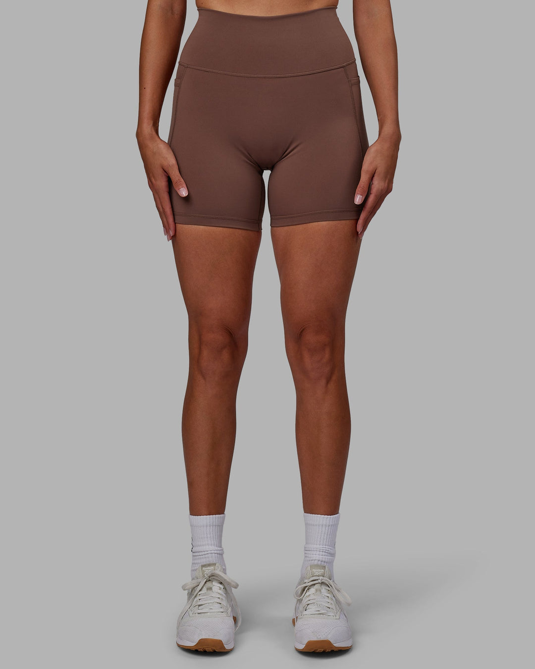 Woman wearing Fusion Mid-Length Shorts - Dull Rust