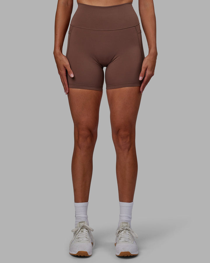 Woman wearing Fusion Mid-Length Shorts - Dull Rust
