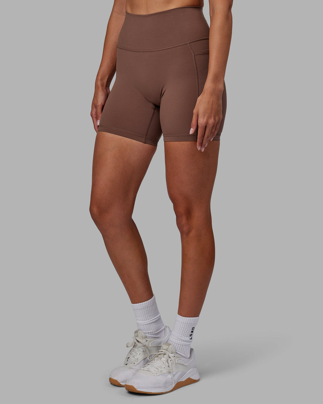 Woman wearing Fusion Mid-Length Shorts - Dull Rust