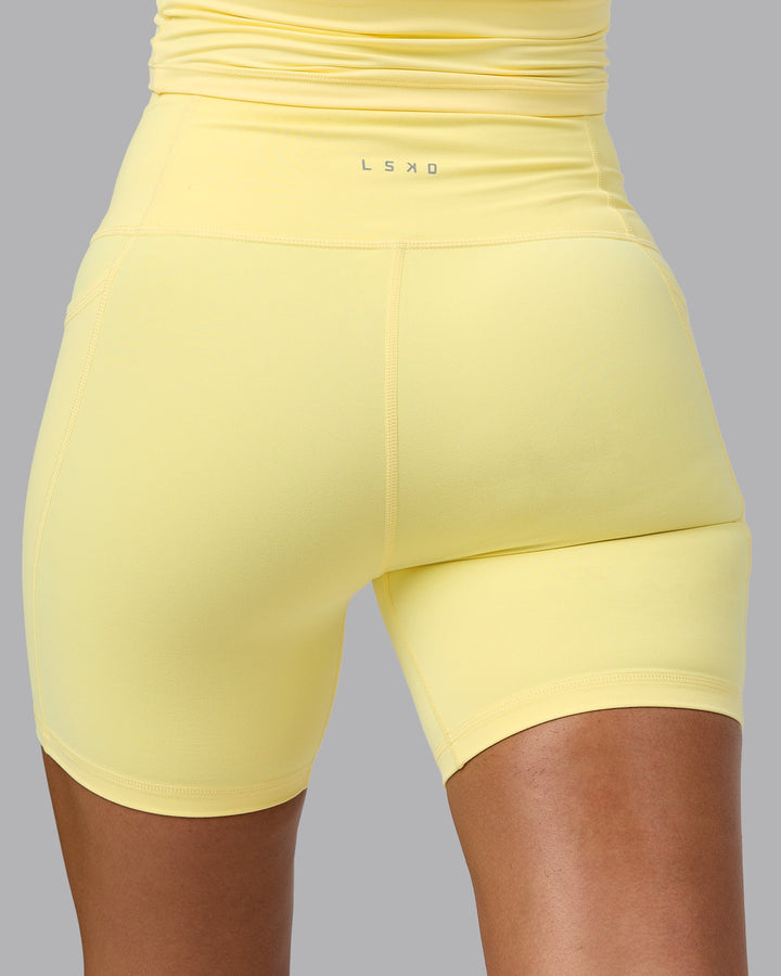 Woman wearing Fusion Mid Short Tights with Pockets - Lemon
