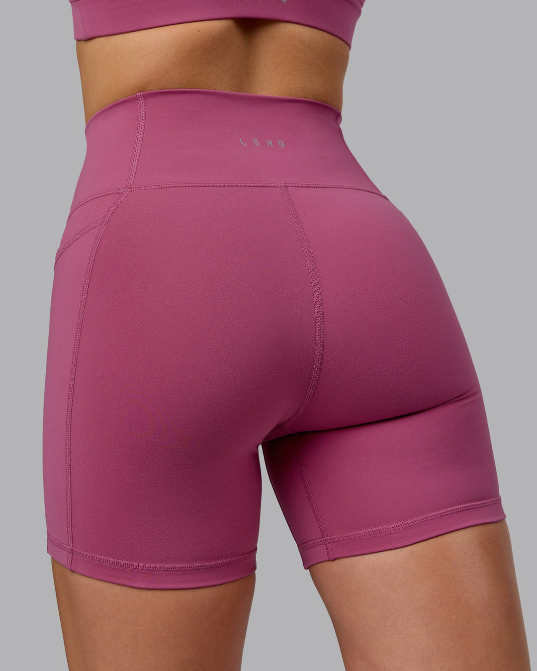 Woman wearing Fusion Mid Short Tights with Pockets - Mauve Haze