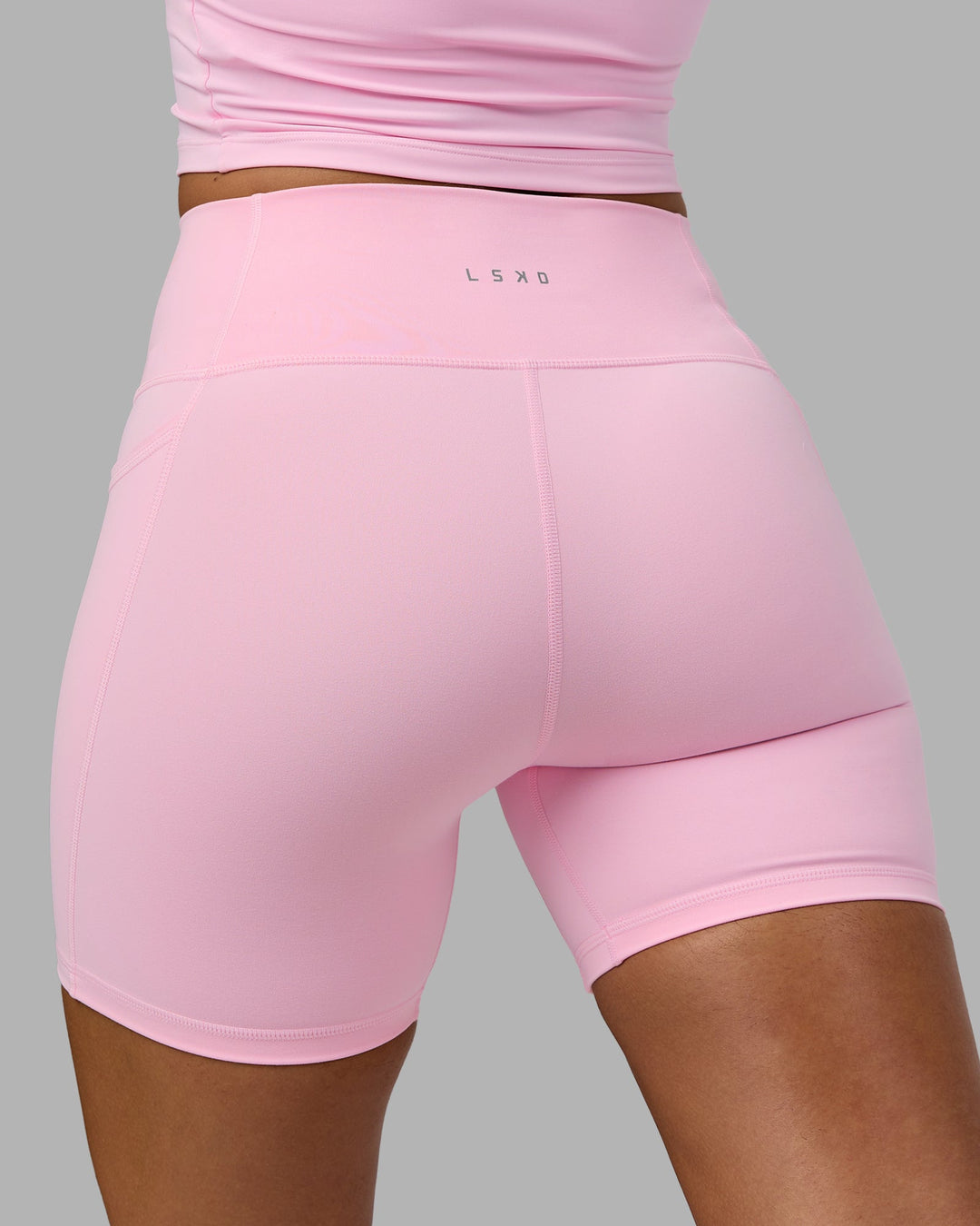 Woman wearing Fusion Mid Short Tights with Pockets - Pale Pink