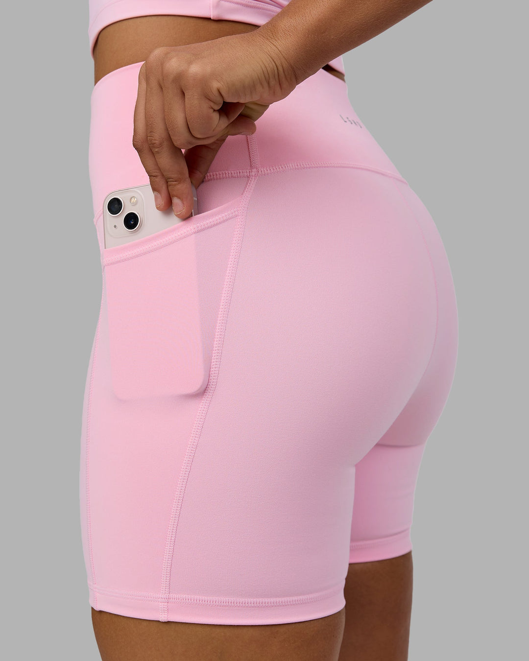 Woman wearing Fusion Mid Short Tights with Pockets - Pale Pink