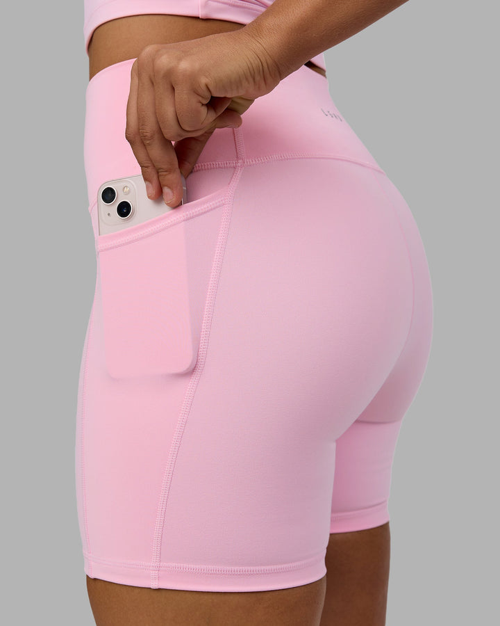 Woman wearing Fusion Mid Short Tights with Pockets - Pale Pink
