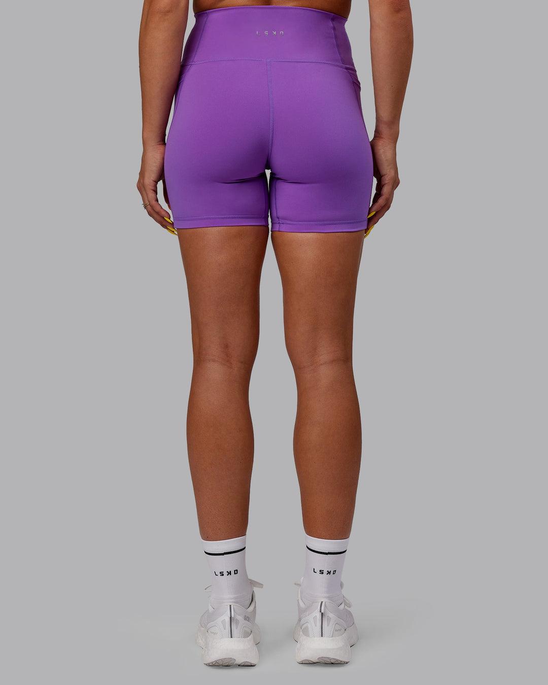 Woman wearing Fusion Mid-Length Shorts - Purple Swirl