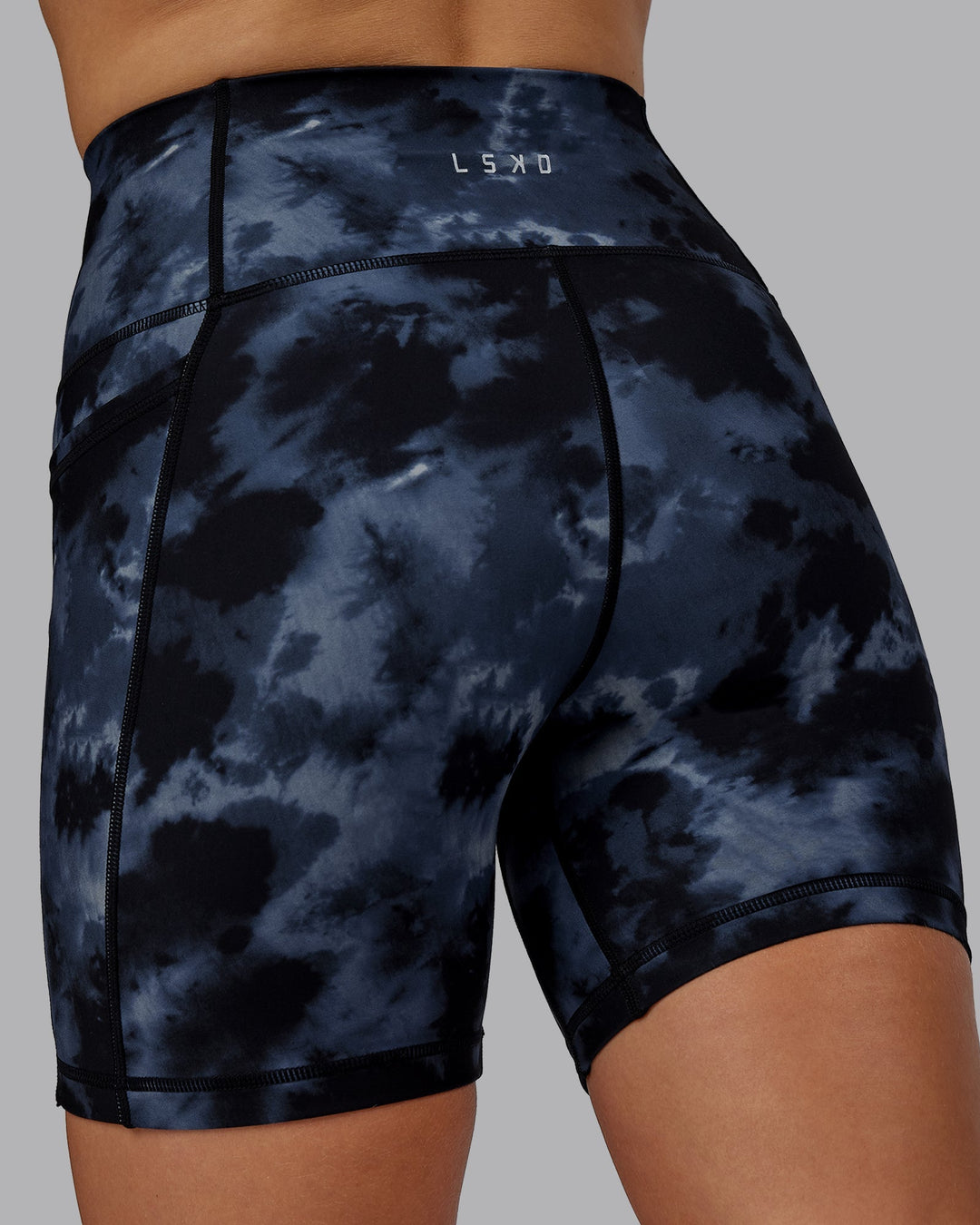 Woman wearing Fusion Mid-Length Shorts - Tie Dye-Midnight